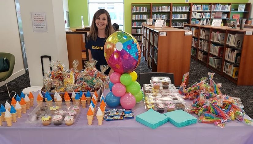 Rotarian Katherin Dilbert, former Director of Vocational Service, at the Reading Program at the Public Library's for Children in all Districts - with refreshments.